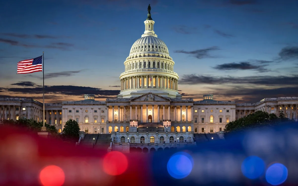 US Capitol with campaign colors at dusk
