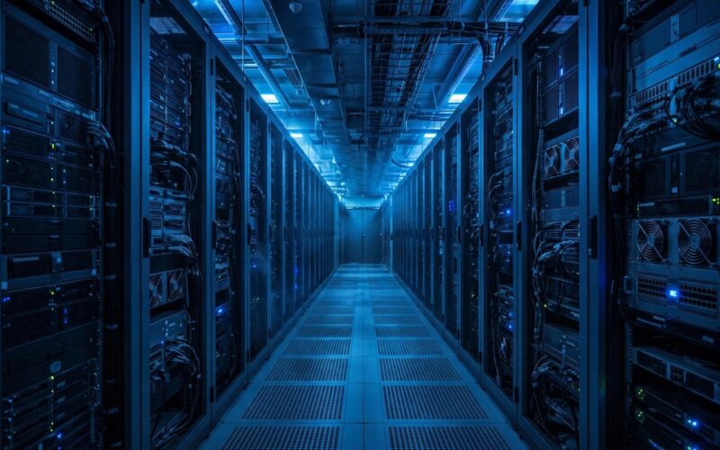 Rows of servers in a modern data centre corridor