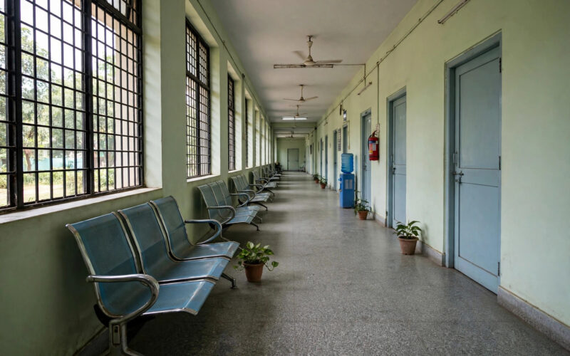 A hospital corridor representing the ESIC health coverage network for workers.