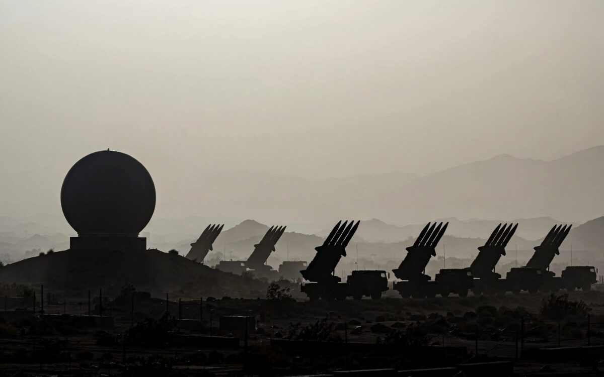 Missile defense equipment at a military installation at dusk.