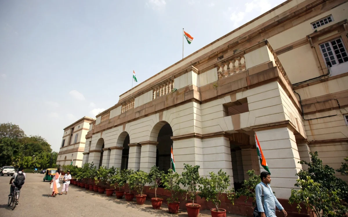 Constitution Club of India building in New Delhi with flags
