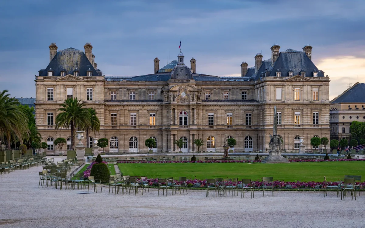 Luxembourg Palace in Paris at dusk with its empty courtyard and gardens.