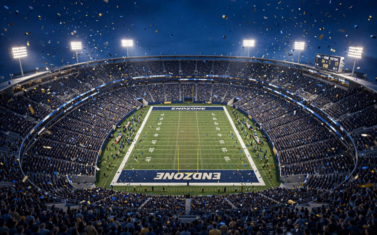 Floodlit college football stadium at night during the Oregon vs USC game