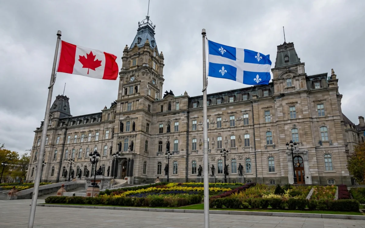 Canadian and Quebec flags outside a government building