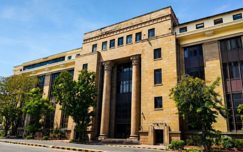 Reserve Bank of India headquarters building in Mumbai under blue sky