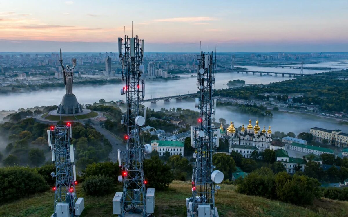 Kyiv city skyline with telecom towers at dawn