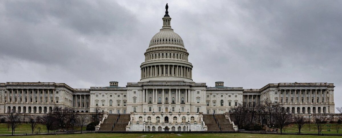 U.S. Capitol dome under a cloudy sky