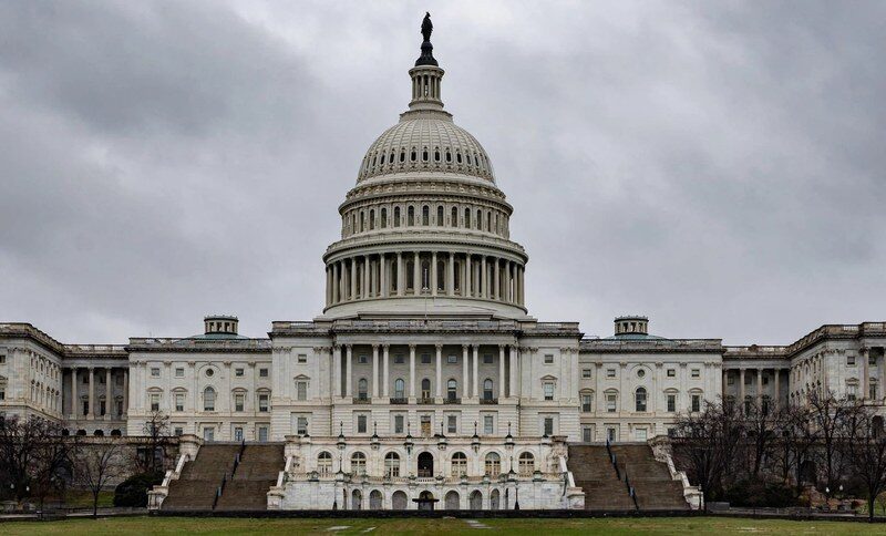 U.S. Capitol dome under a cloudy sky