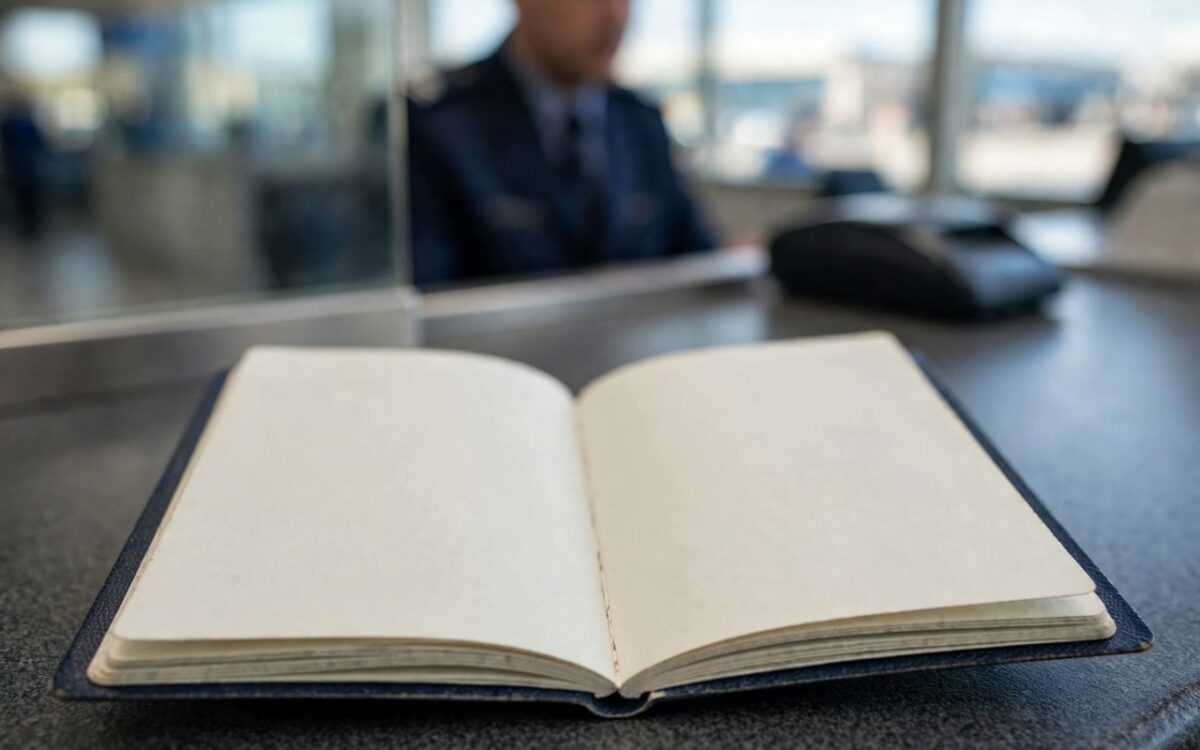 Traveller's passport held open at a US airport immigration counter